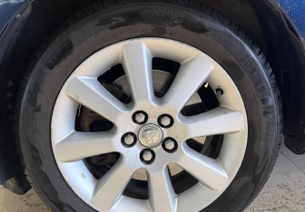 Подержанный автомобиль Toyota Avensis Liftback 2003 года (14 фото)