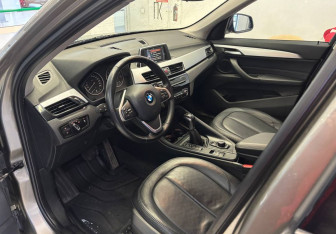Подержанный автомобиль BMW X1 2015 года (14 фото)