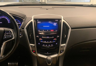 Подержанный автомобиль Cadillac SRX 2014 года (13 фото)
